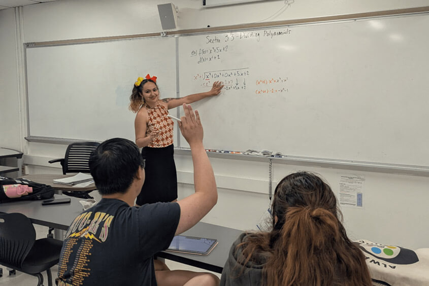 Monique Howe teaching math to other students in class 