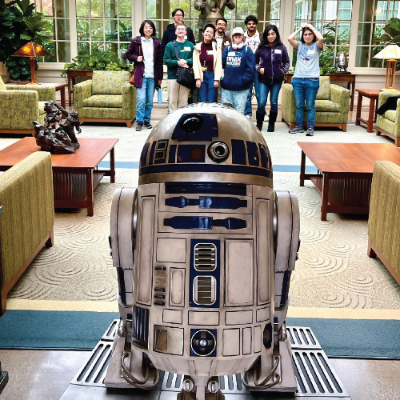 Students posing with R2-D2