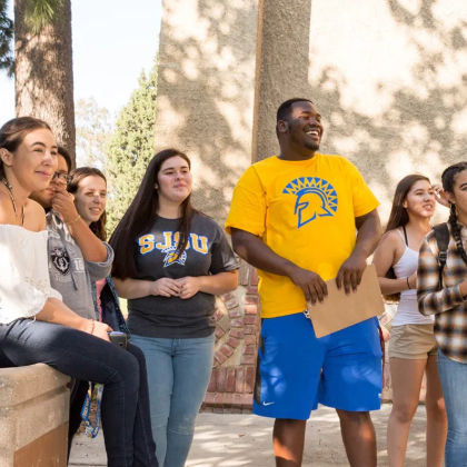 A group of SJSu students looking toward the camera to the right.