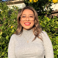 Lisette Valenzuela Headshot of graduate student Lisette Valenzeula under a lemon tree.