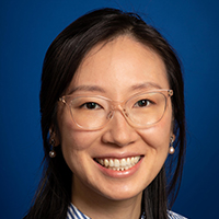 headshot photo of Stella Wang with light frame glasses