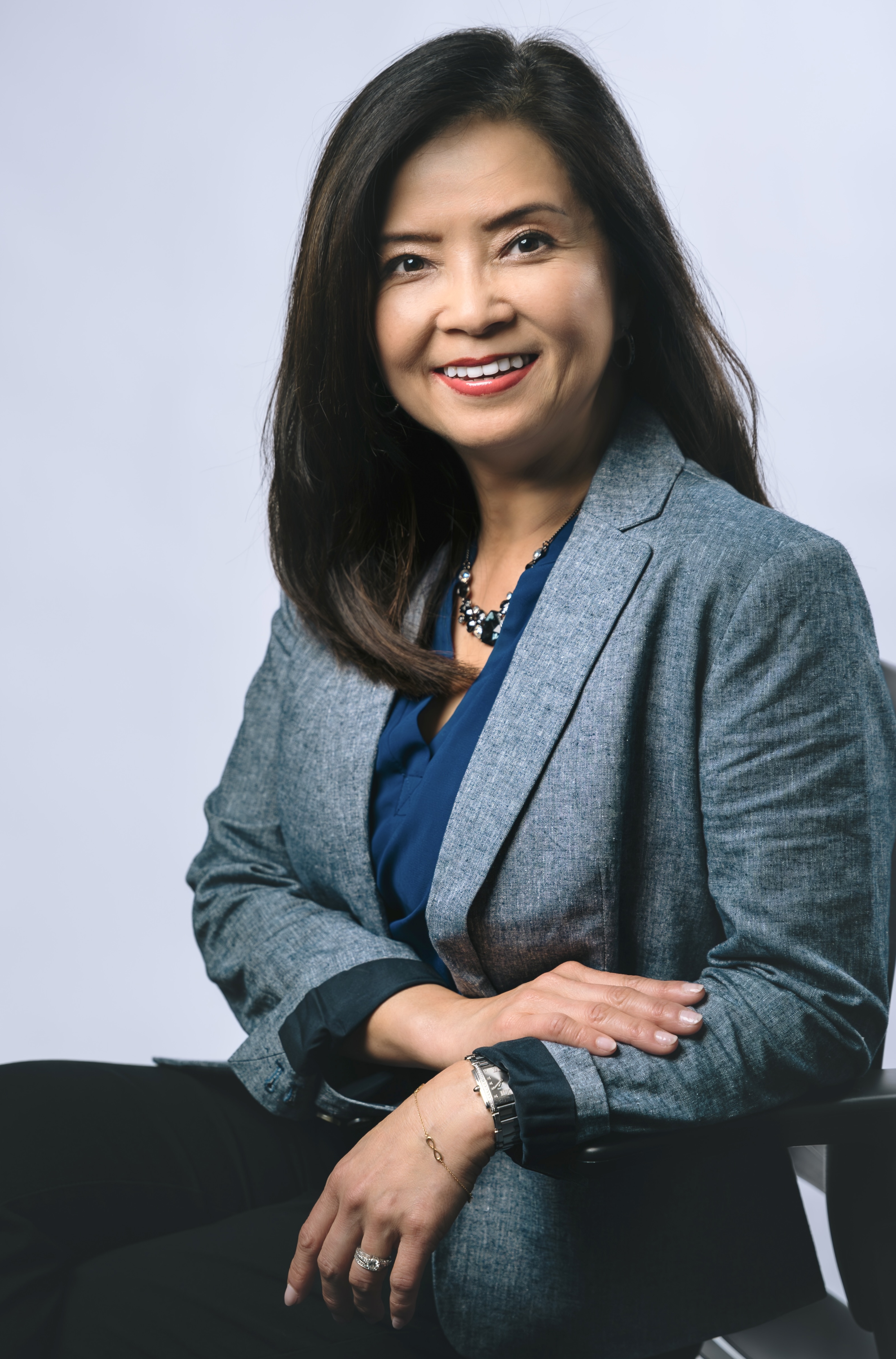 Photo of Jessica Larsen sitting down with arms crossed Jessica Larsen