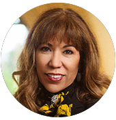 SJSU President Teniente-Matson A woman wearing a black and yellow scarf.